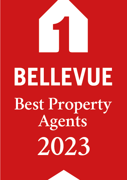 Auf dem Bild ist ein rotes Logo mit einem weißen Haus-Symbol und der Aufschrift 'BELLEVUE Best Property Agents 2023'.